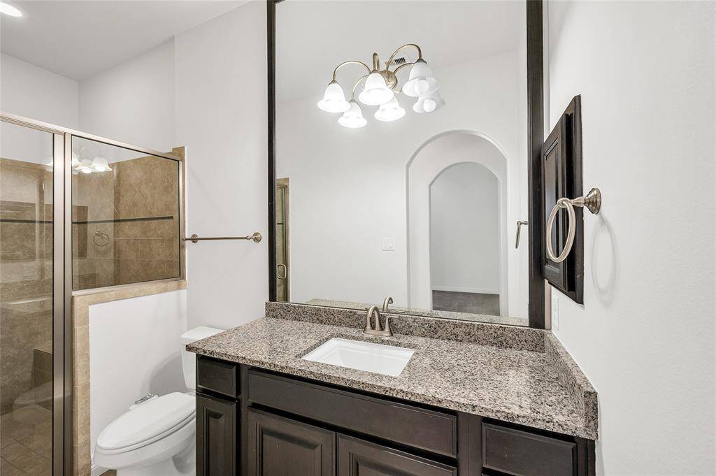 Full ensuite bathroom off the second main-level bedroom.