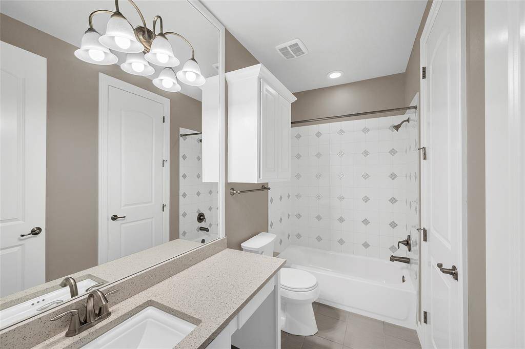 Guest bath with direct access from the 4th bedroom suite.