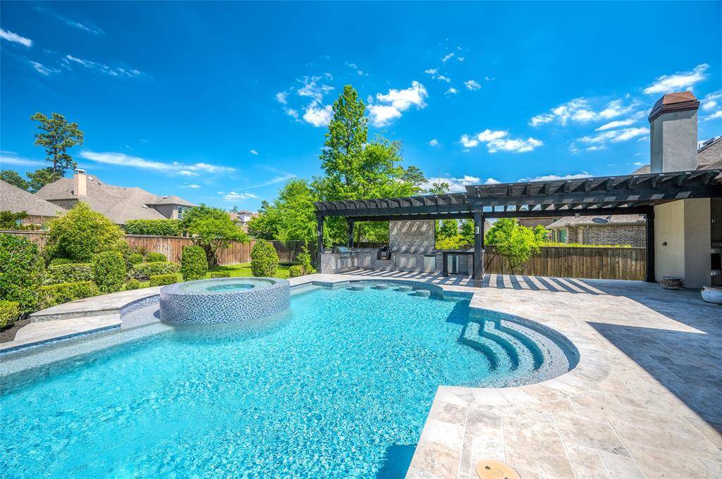 Stunning modern pool design featuring elegant, curved steps leading into the water.
