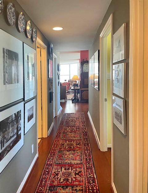 Hallway from primary bedroom looking back to formal areas