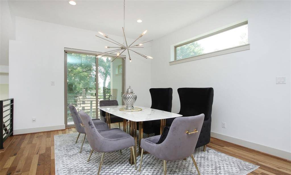 Another view of the dining area that comfortably fits a 6-8 seat dining set. Behind the dining area is a large covered balcony. A peaceful place for fresh air and relaxing after dinner.