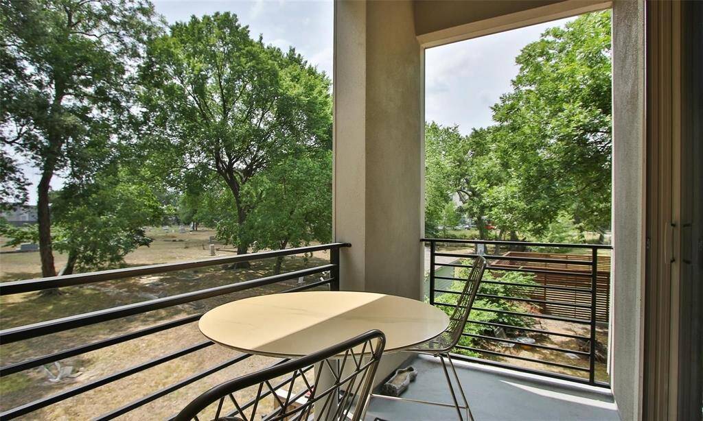 Find time to enjoy the fresh air on this peaceful and oversized balcony leading from the dining area.