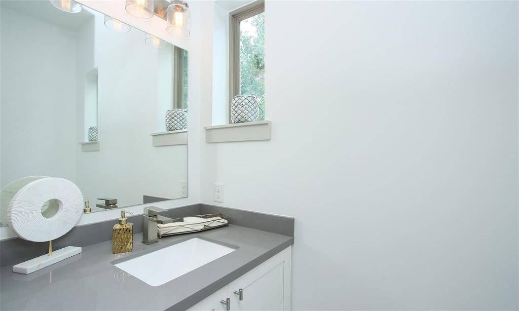 Second floor half bathroom off the living room area.