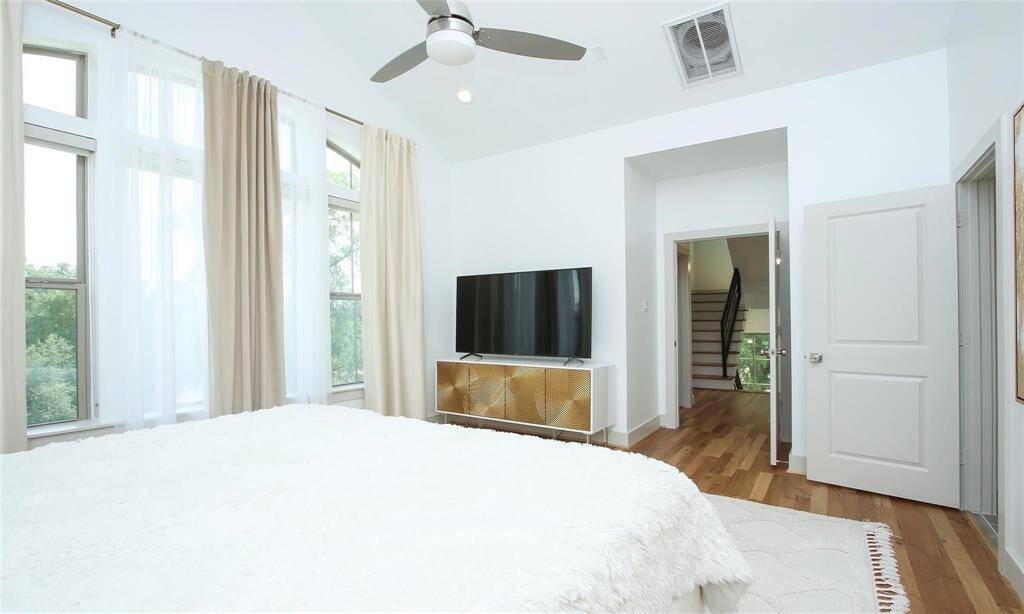 Ensuite bathroom and walk-in closet to the right of this picture. Ceiling fans can be found throughout the home.