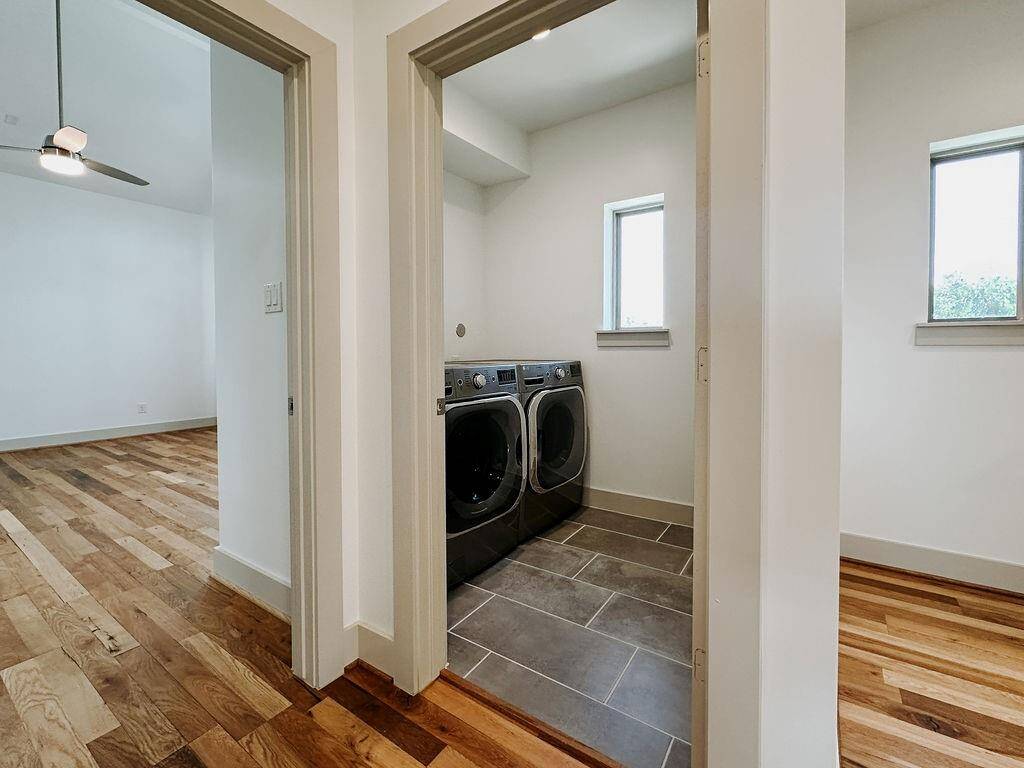 Full sized utility room with modernefficient LG appliances.