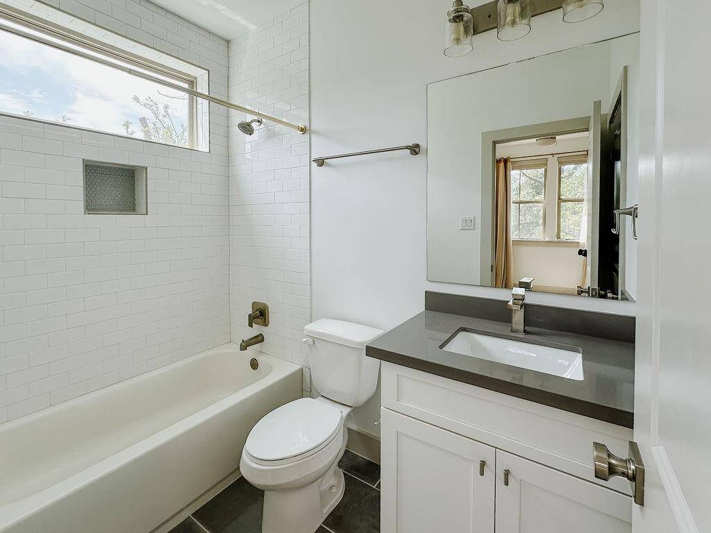 Modern full bath ensuite in the first floor secondary bathroom.