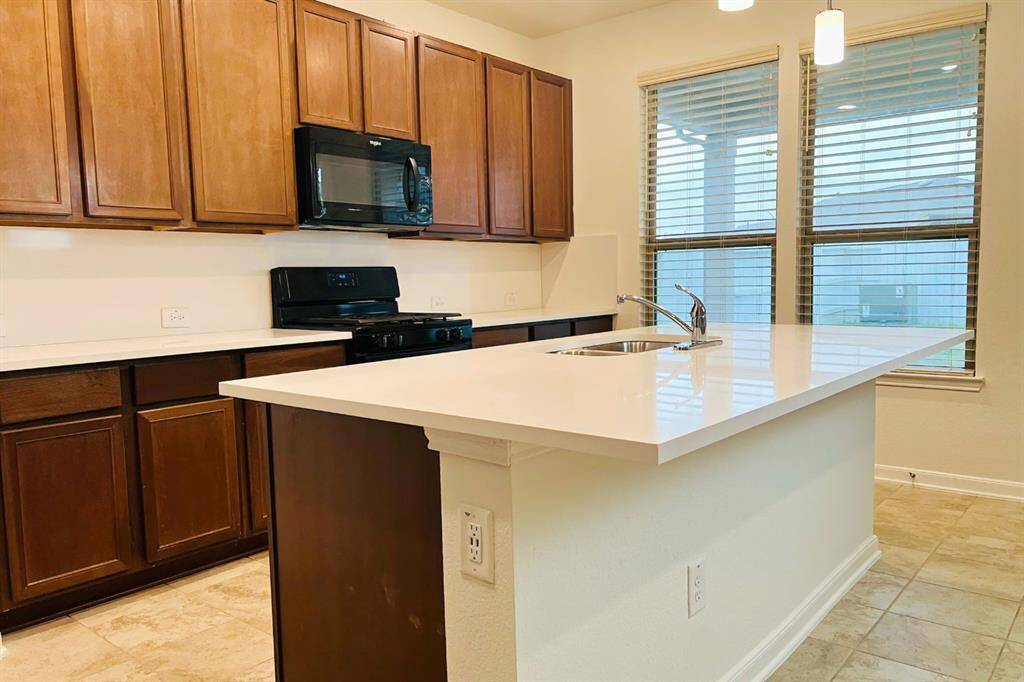 1 1/4 inch white Quartz countertop and Backsplash. Looks Gorgeous.