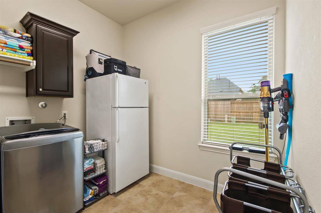 Utility room next to breakfast area and kitchen.
