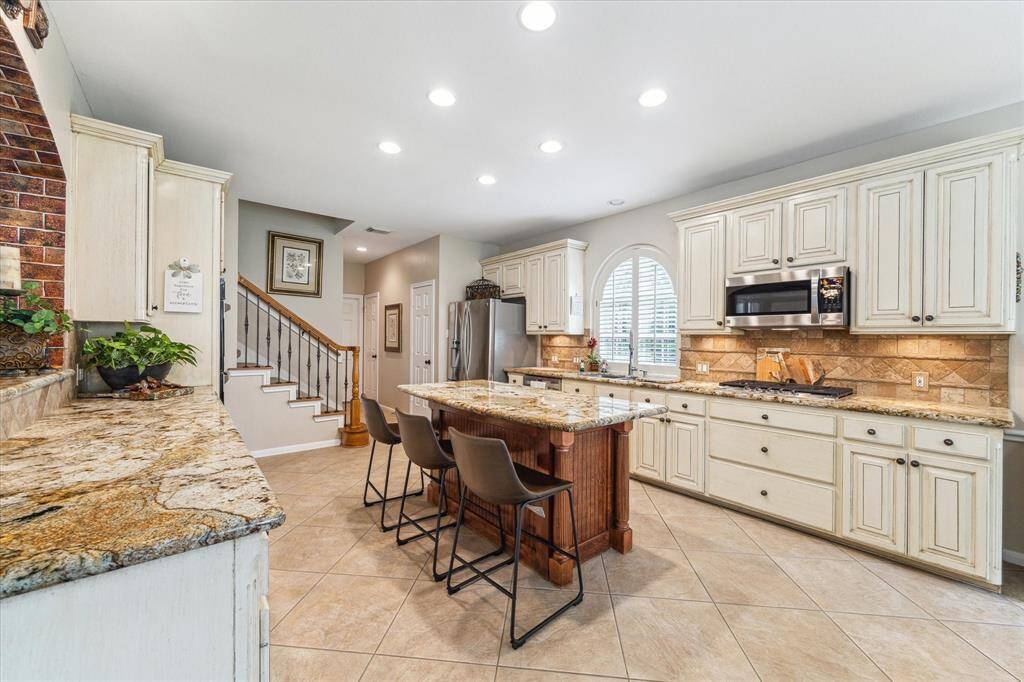 Note the back stairwell. The powder room and laundry room are beyond the stairs.