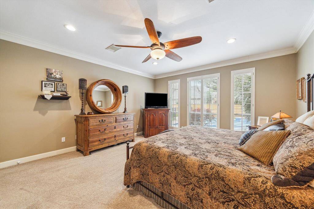 This room accommodates a king-sized bed with plenty of room leftover for additional furniture. Ceiling fans throughout the house provide additional comfort.