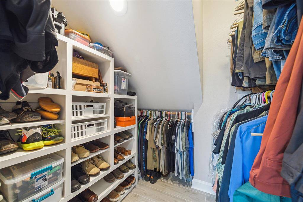 One of two walk in closets in the Primary Bathroom. The other one has a window.