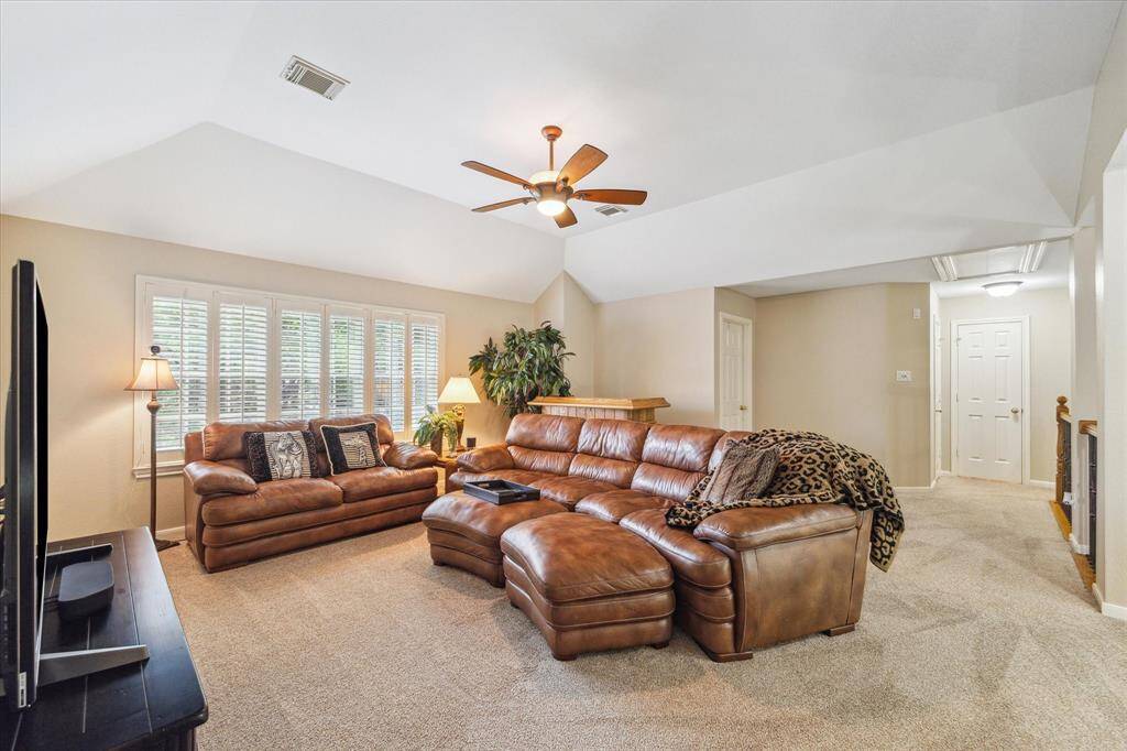 Upstairs is a spacious game room that separates the four bedrooms. Many ballgames have been viewed here. There are high ceilings and huge storage closets.