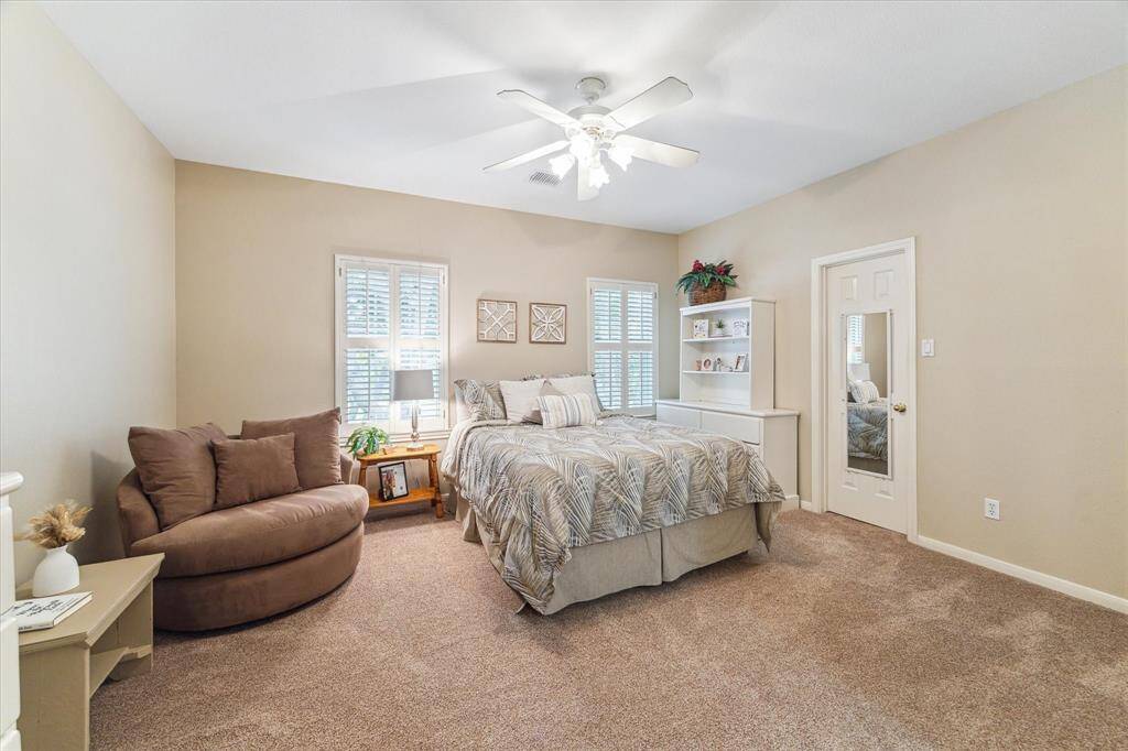 The first of four spacious secondary bedrooms. This one has a huge closet for your fashionista. It overlooks the front yard.