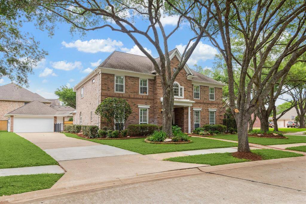 The long driveway allows for extra parking, or play. Set up your basketball goal or pickleball net. The oversized two car garage is complete with shelving, workbench cupboards and attic storage. The garage door was recently replaced.
