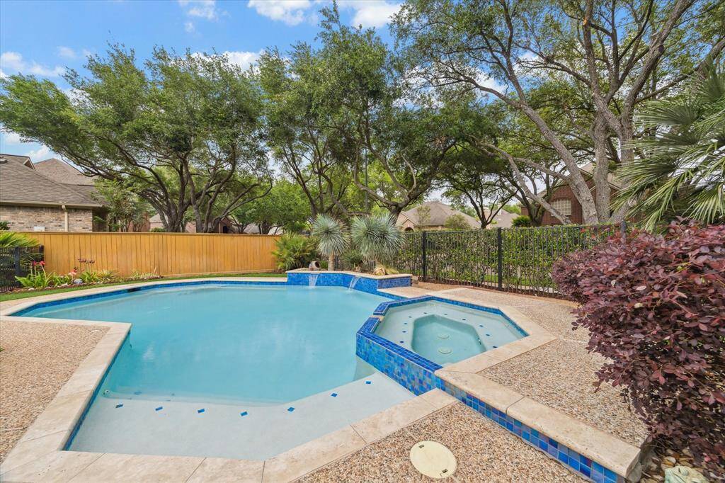 This pool is equipped with many self cleaning features and has been recently re-plastered and retiled with beautiful iridescent tile. Soothing waterfall features circulate the water.