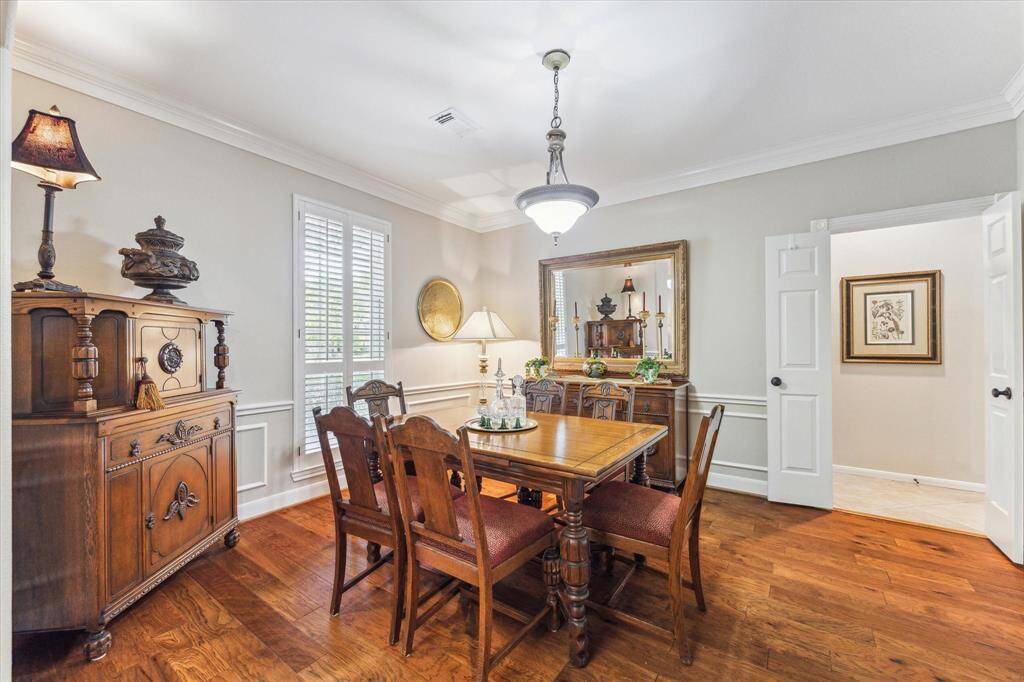 The formal dining area is highlighted by crown molding, chair rail and picture frame molding.