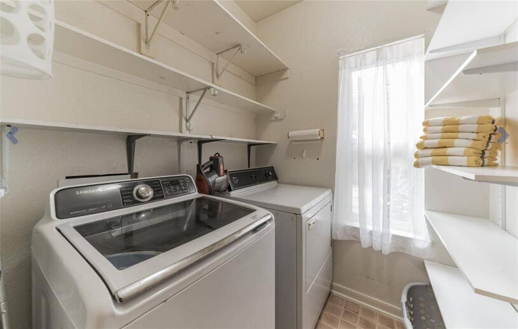 Utility room with full size washer and dryer