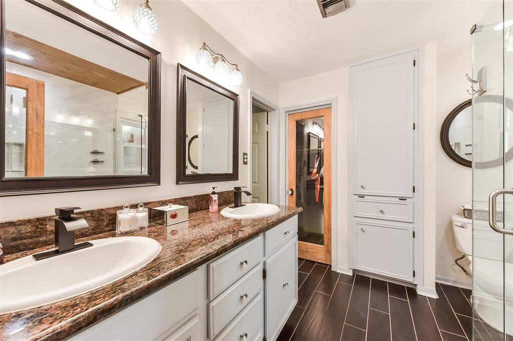 His and her closets in the primary bath