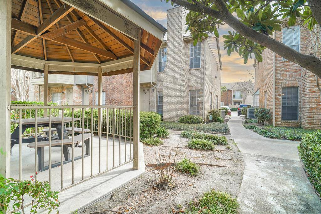 A charming gazebo nestled near the back yard, perfect for relaxing and entertaining.