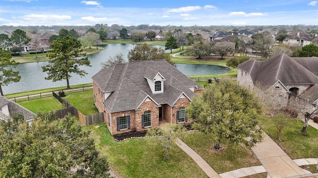Enjoy the breathtaking beauty of a tranquil lake right in your backyard, creating a peaceful and relaxing atmosphere.