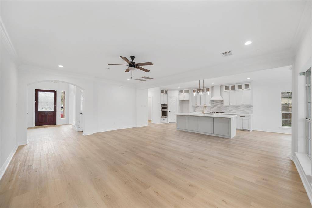 Bright and spacious open floor plan family room seamlessly connects to the kitchen and breakfast area.