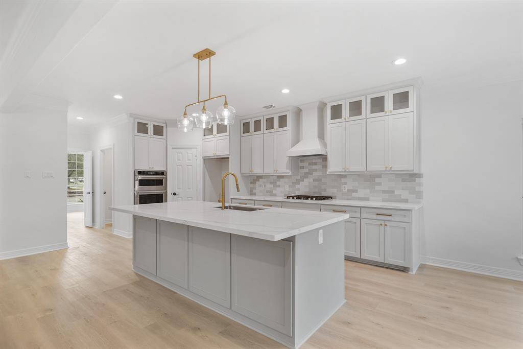 A spacious island provides additional prep space and doubles as a casual dining area.