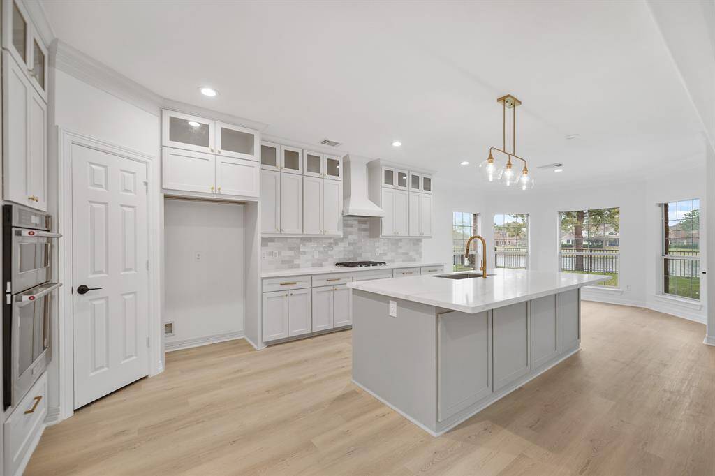 Durable and elegant granite countertops elevate the kitchen’s style while providing a premium workspace.