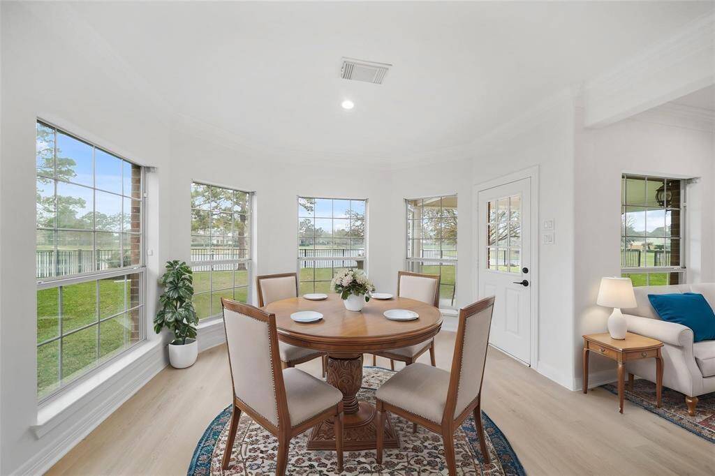Cherry breakfast area with tons of natura light and door access to the beautiful backyard.