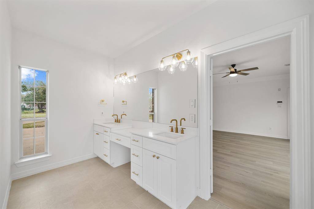 Primary Bathroom offers a dual sink for his & her personal space.