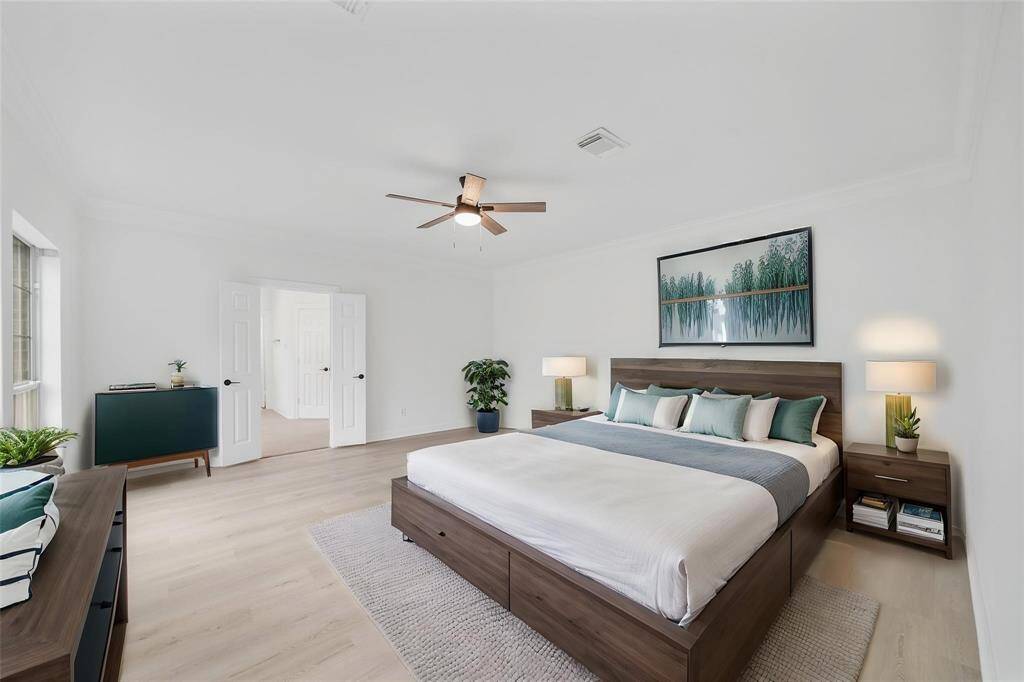 Bedroom 4 offers plush carpet flooring and soaring ceilings.