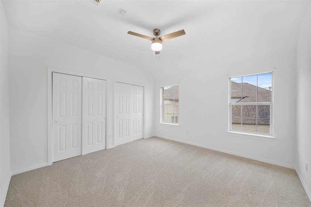 Ample storage space awaits in this bedroom, complete with oversized closets perfect for organizing clothes, accessories, and more.