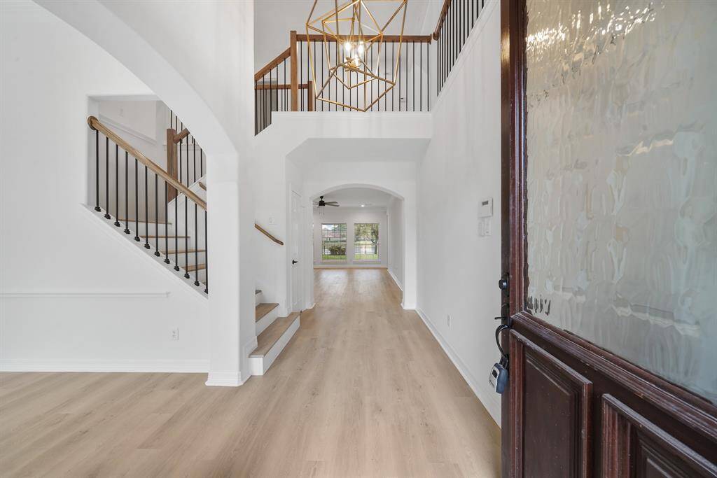 The elegant entryway seamlessly flows into the main living areas, setting the tone for a warm and welcoming home.
