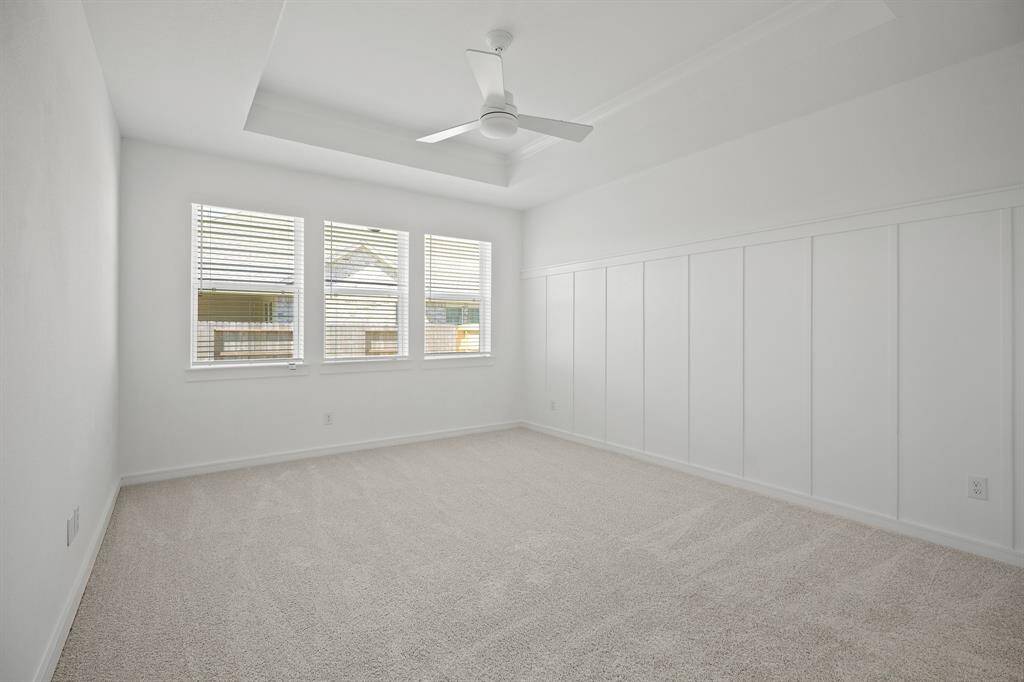 Spacious primary suite with feature wall and ceiling treatment (*Photo not of actual home and used for illustration purposes only.)