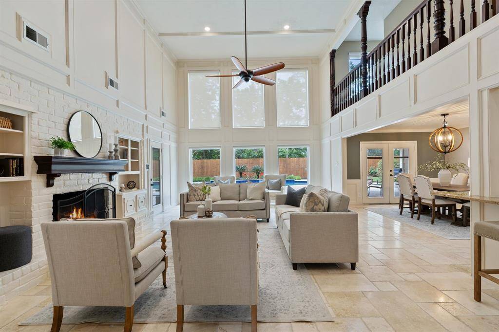 HUGE living room with two story ceilings and TONS of natural light.