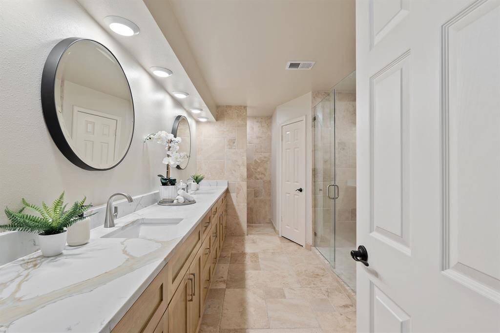 Brand new custom cabinets, granite countertops, and updated lighting.