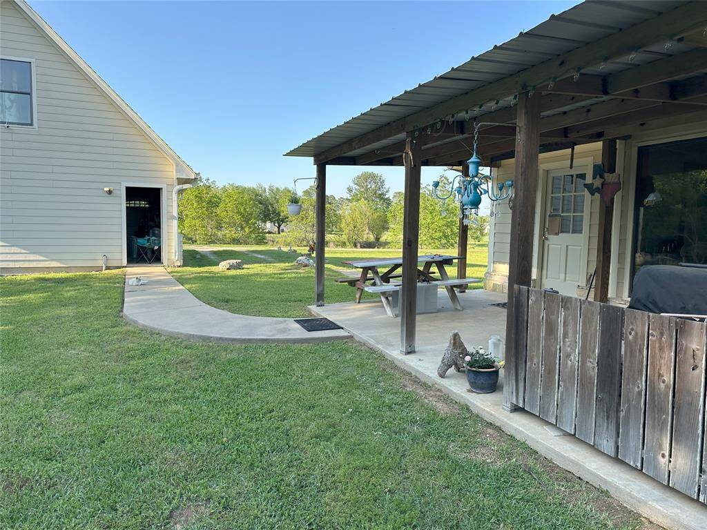 The large back porch allows for easy evenings sitting and listening to your nature.