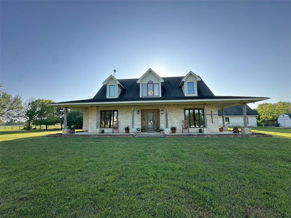 The front of the house offers a beautiful silhouette of country elegance.