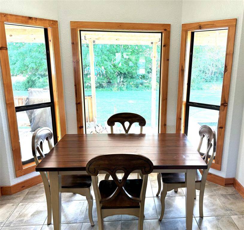 This classic breakfast nook featuring bay windows into the backyard are perfect for quiet mornings with a delicious coffee!