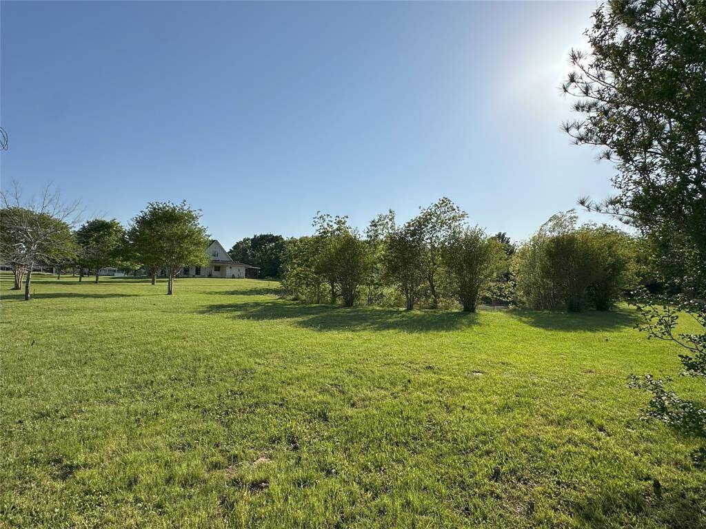 A view from the right side of the property highlights your own private pond and home.