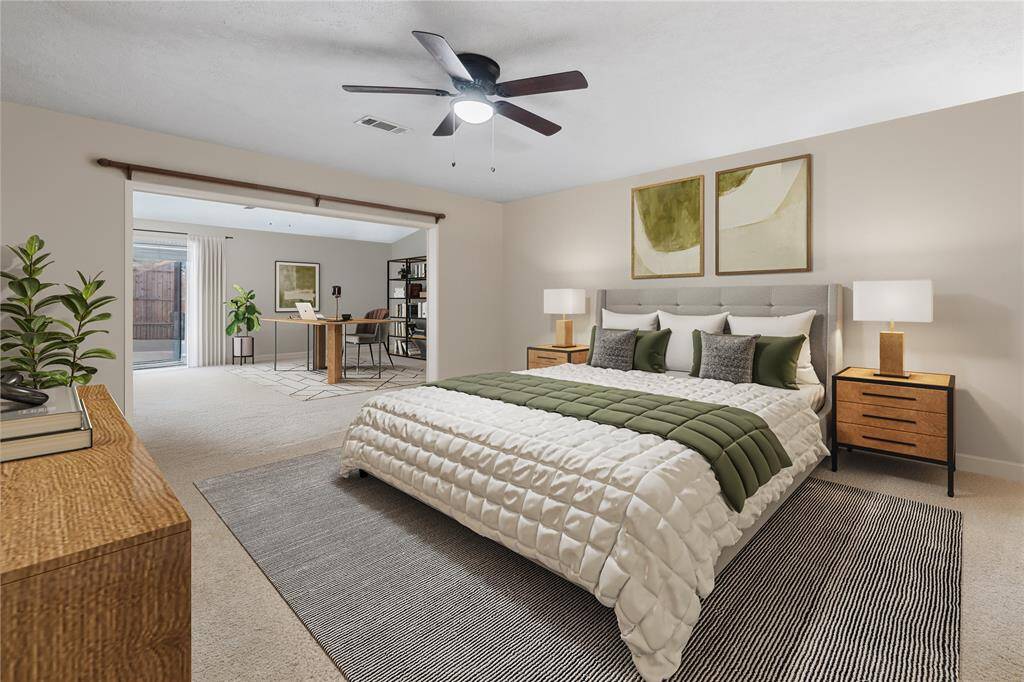 Virtually Staged to Highlight its Potential as a Home Office, the Primary Bedroom offers added Flexibility and Space.