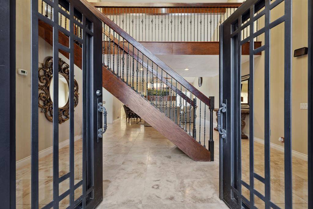 Elegant Wrought Iron Double Entry Door.