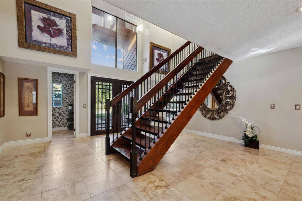 Stunning First Impression with this Sophisticated Wood Staircase.