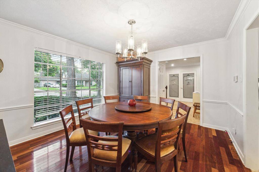 Formal dining room to the right of the entry has fantastic hardwood floors, crown moulding and chair railing. It's a wonderful space for gatherings!