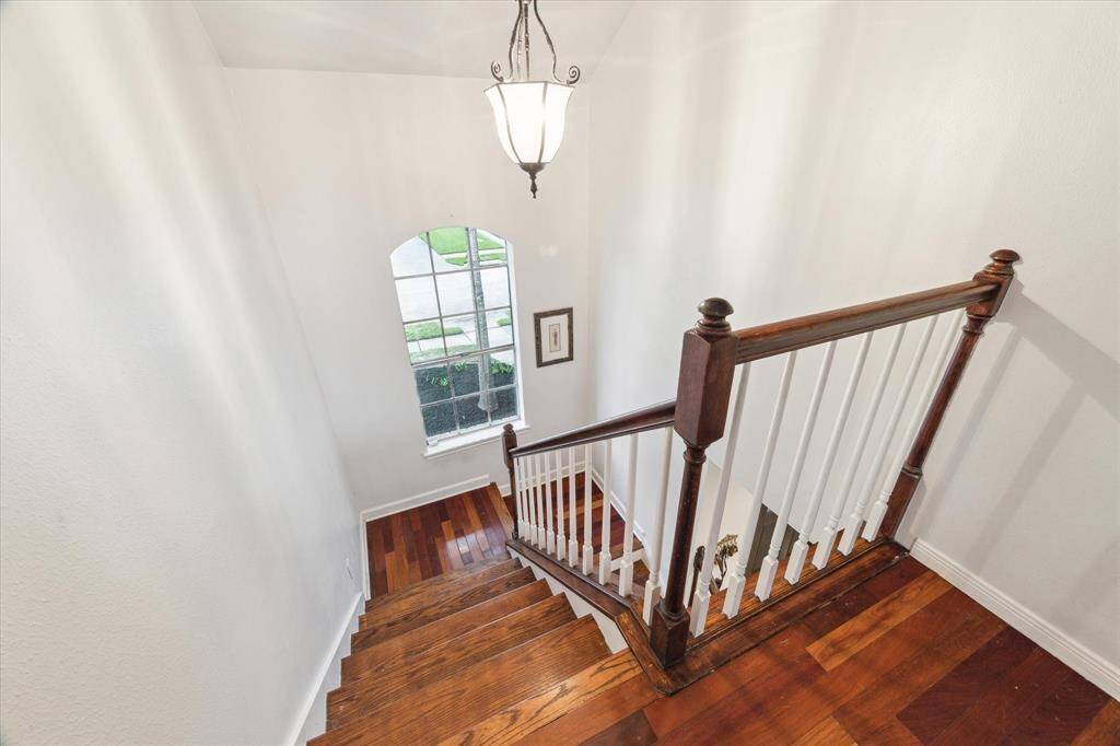 Hard wood floors in this home were revealed when the carpet was removed! ABSOLUTELY BEAUTIFUL! Grand staircase with natural light.