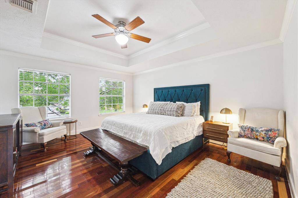 Extra-large upstairs primary bedroom with tray ceiling and GORGEOUS hardwood floors. You'll rest easy knowing your loved ones are close by.