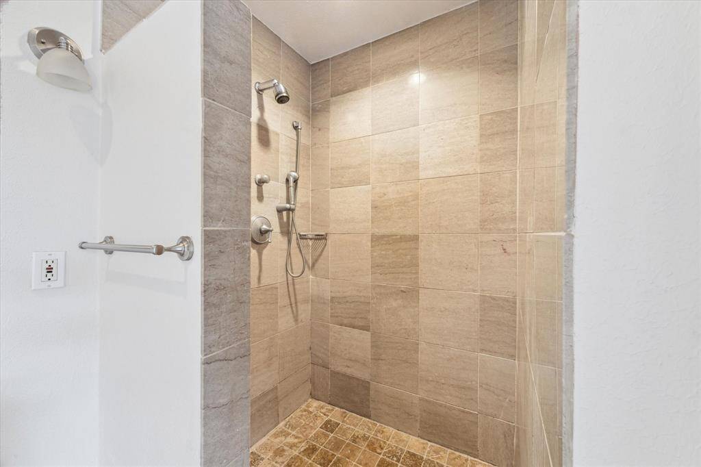 Primary shower is spa-like--and no glass to keep spot-free!