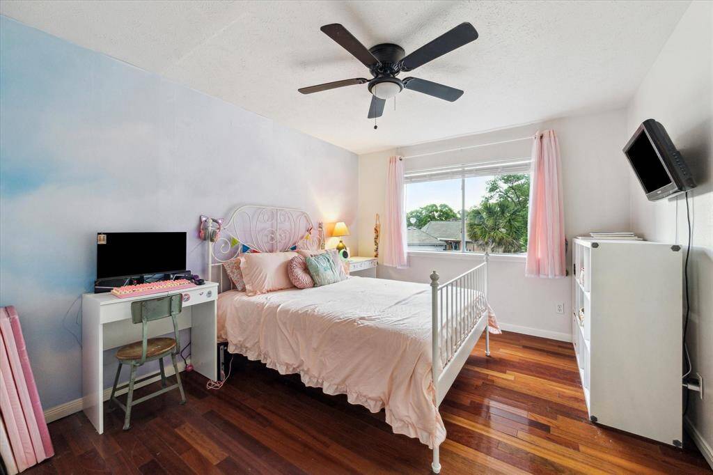 Bedroom 3 has lots of natural light and hardwood floors and large closet!