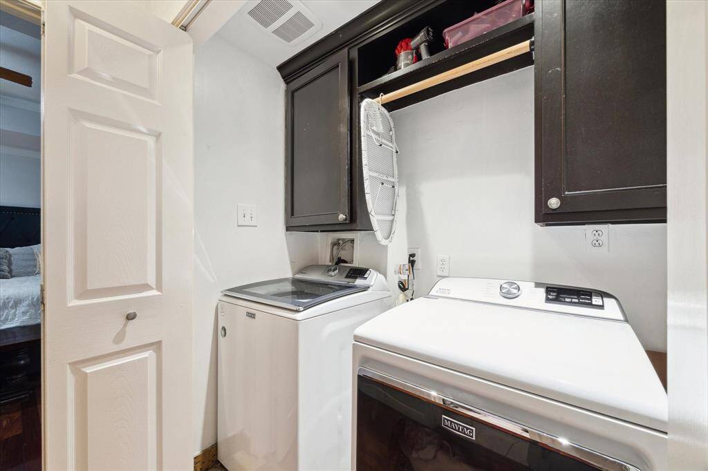 The laundry space is located right outside the primary bedroom for your convenience. Maytag washer and dryer will convey!