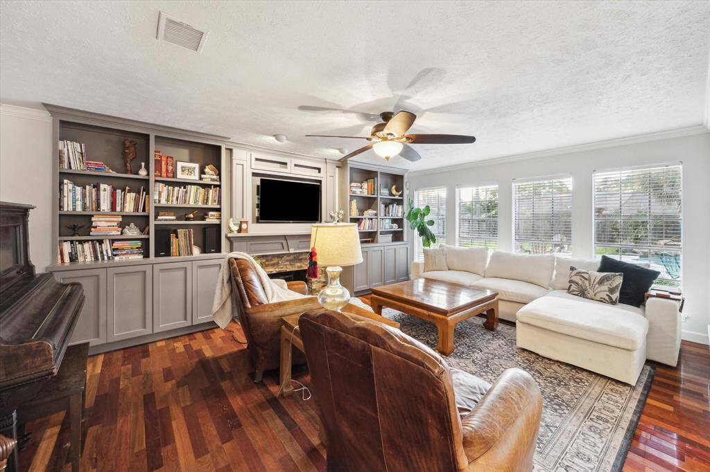 The wood floors and built-ins are to die for! Fireplace for cozy evenings together, shelves for all the books and collectables, AND THAT VIEW!