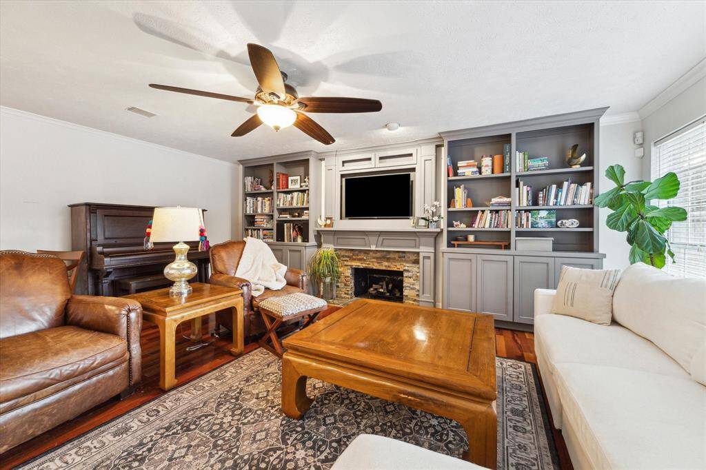 View of the family room from the back glass door. SO MUCH SPACE for ALL of your living and enjoying one another!